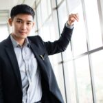 Asian business man in formal style standing in the office