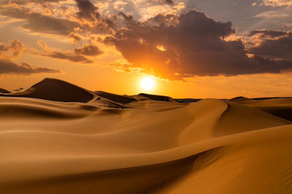 Sunset over the sand dunes in the desert. Rub' al Khali desert
